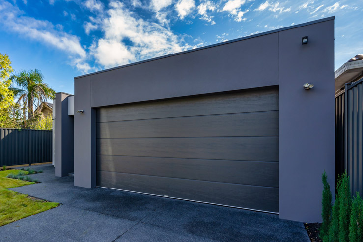 Modern home with a wide-panel garage door
