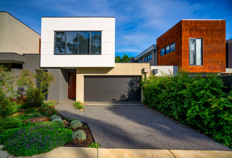 Garage door with a smooth panel finish on a modern home